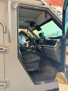 StandA.R.D. installed in an IAG Sentinel armored vehicle, rifle within reach of the driver's seat